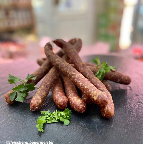 Schinkenknacker (pro Stück ca. 80g), Preis pro Kilo 29,90€ - Anzahlung